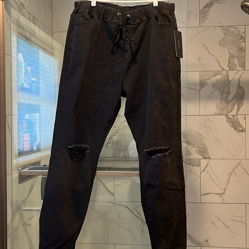 Women’s distressed black jean joggers. Size 2x. Elastic/drawstring waist. NWT